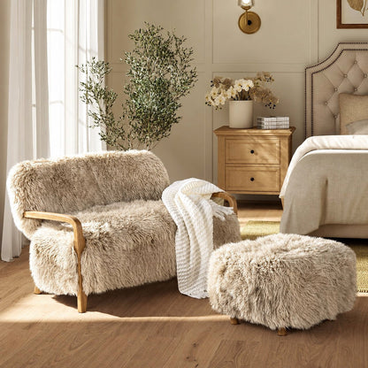 Enchante Sheepskin Accent Loveseat — in a bedroom with an ottoman and throw shown as styling props