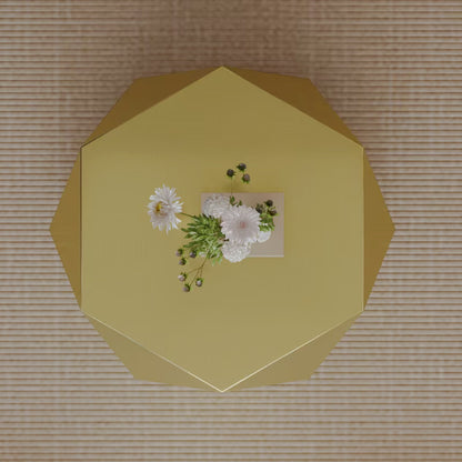 Overhead view of gold-tone geometric coffee table with a faceted polygonal top