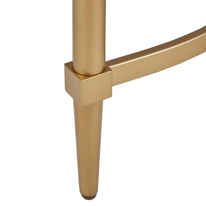Close view of the Bordeaux console gold-tone leg and curved stretcher connection