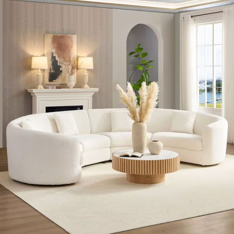 Ivory Curved Sofa with Four Pillows — opposite angled room view.