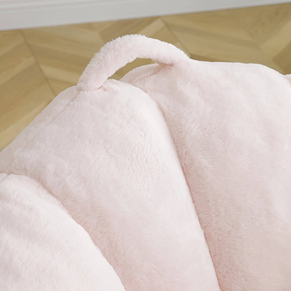 Seashell Faux Fur Lounge Chair with Footrest — faux fur backrest and pillow close-up.