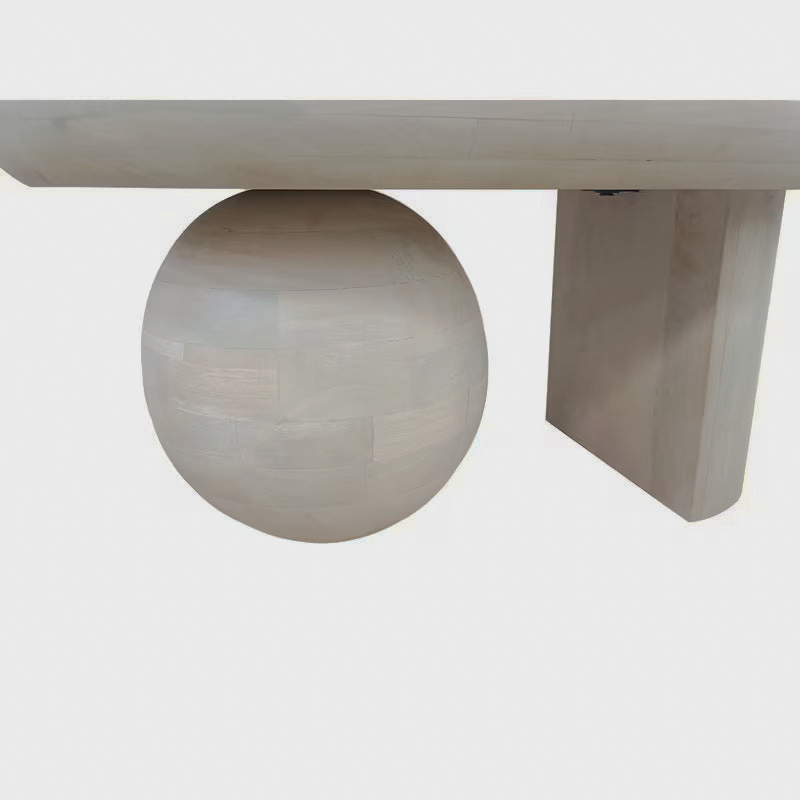 Close-up of the round ball support beneath the washed-white tabletop