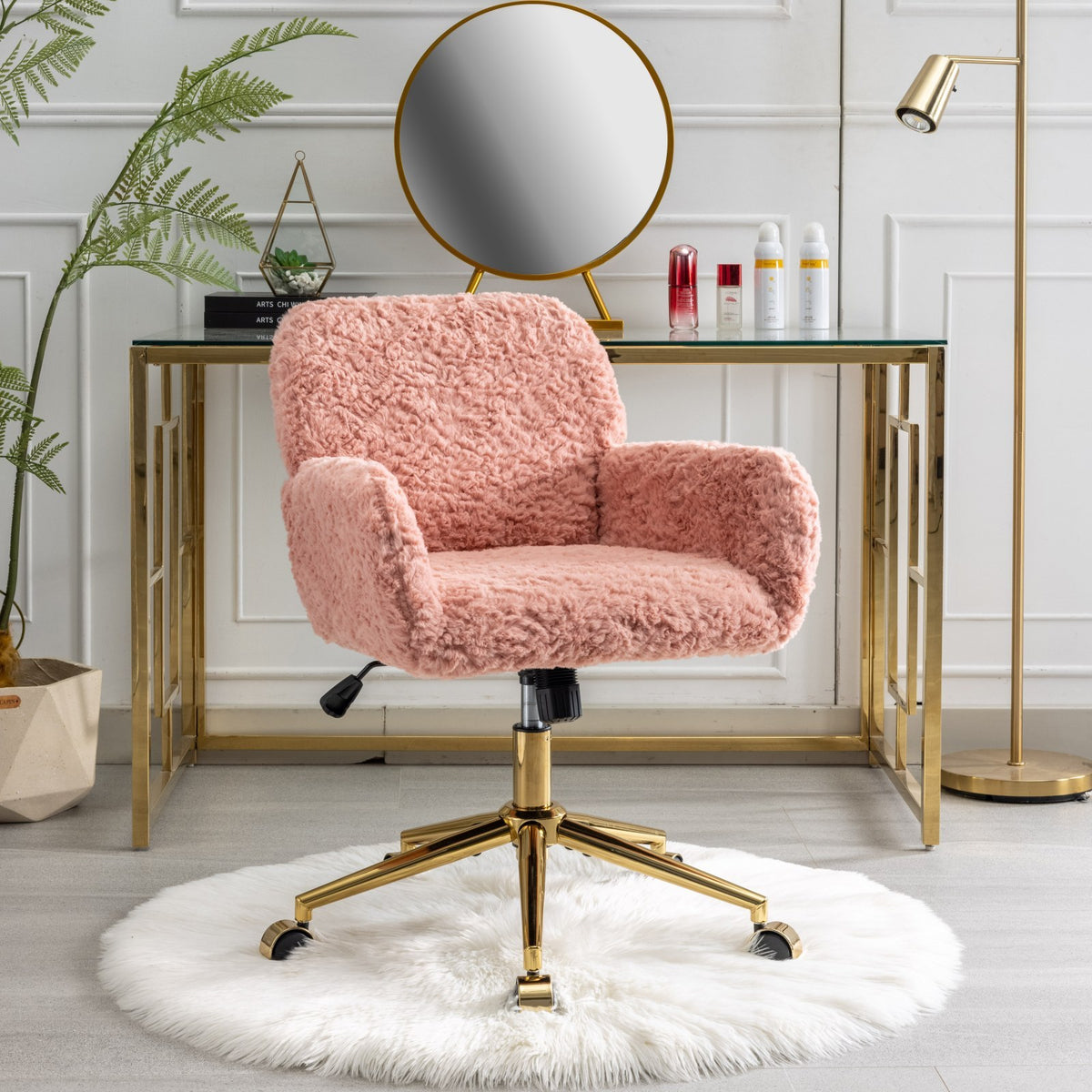 Angled view of the pink faux alpaca chair and gold-tone base