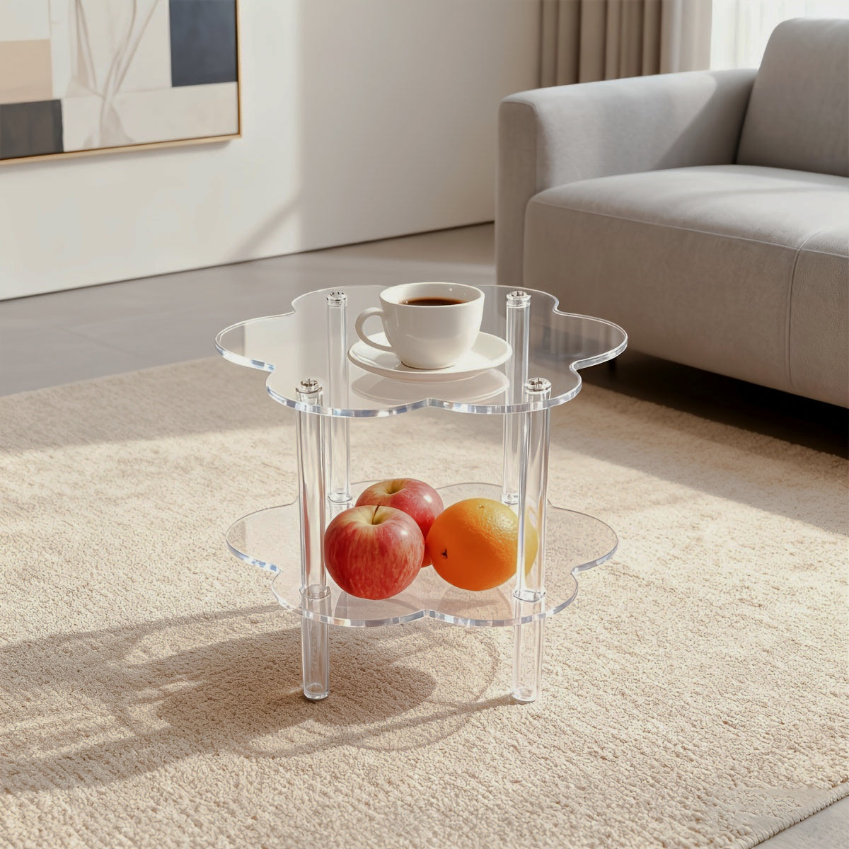 Clear cloud-shaped acrylic side table with a lower shelf beside a sofa