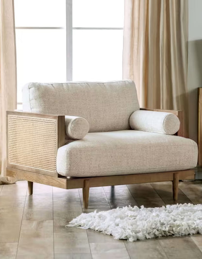 Beige Cane-Side Accent Chair with Bolster Cushions — beige chair front view