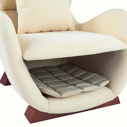 Beige sculptural upholstered accent chair with a curved wood frame and lower storage nook