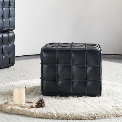 Square Tufted Ottoman — front three-quarter view of the black ottoman