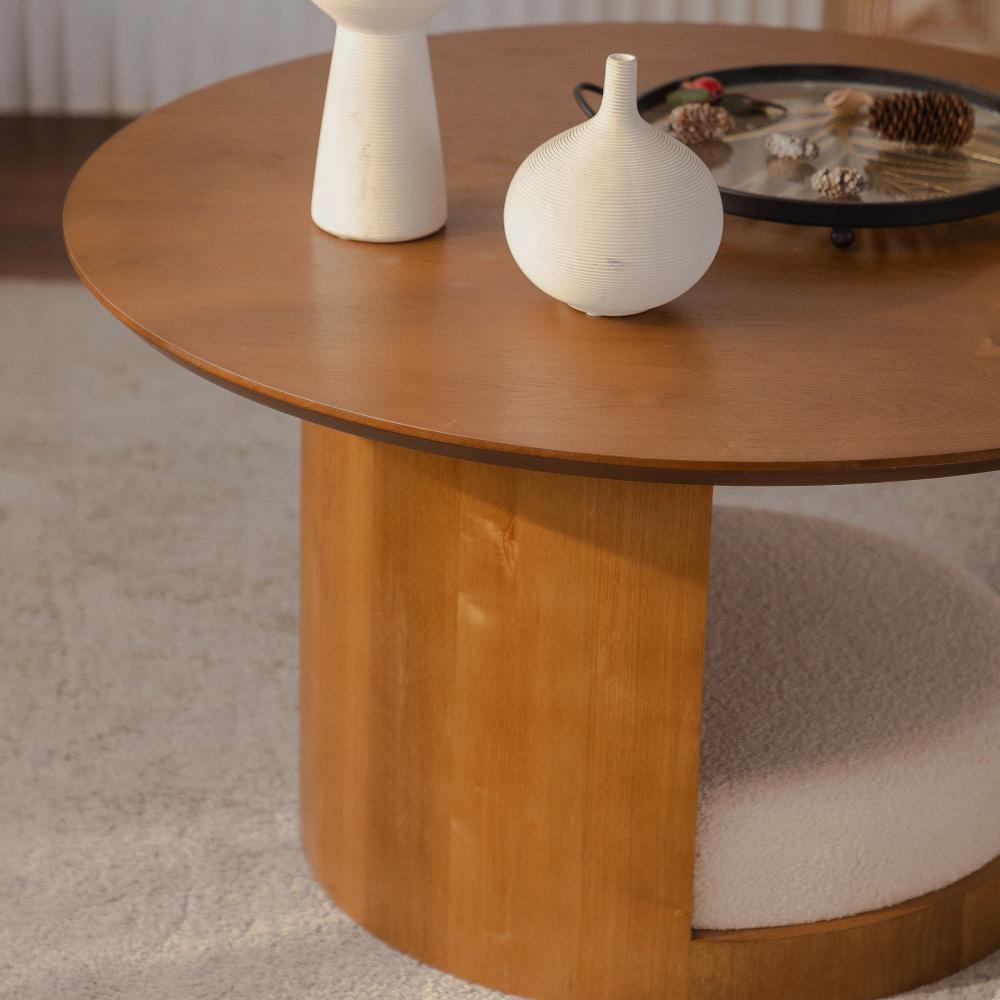 Close-up of the round tabletop, curved base and nested upholstered stools