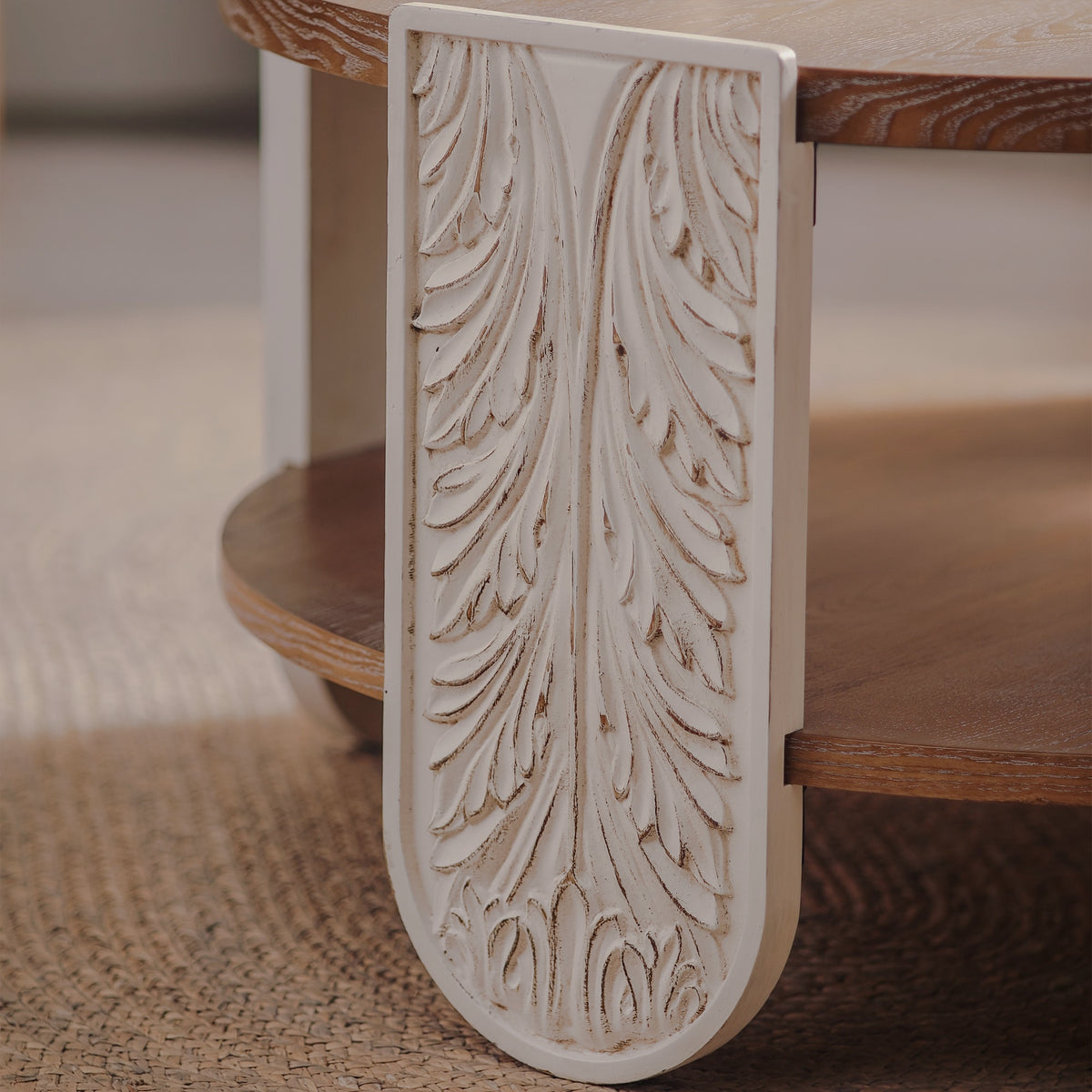 Close-up of cream leaf-carved leg detail