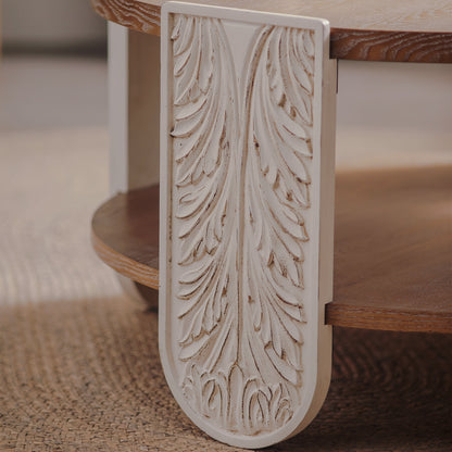 Close-up of cream leaf-carved leg detail