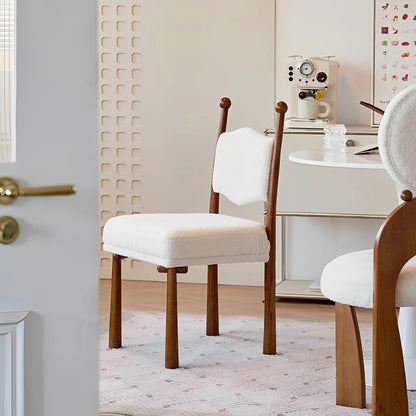 Ivory textured dining chair with a turned wood frame