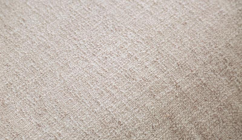 Beige Cane-Side Accent Chair with Bolster Cushions — beige fabric texture close-up