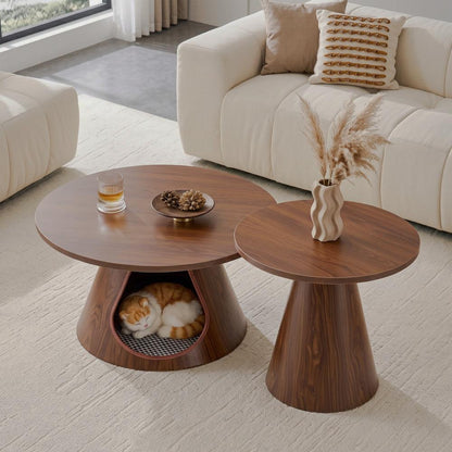 Two round walnut-look tables, one with an integrated cat cubby, in a cream living room