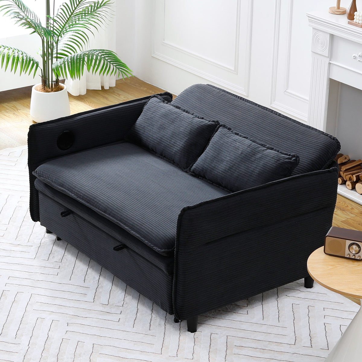 Ribbed Convertible Sleeper Sofa with Cup Holders — three-quarter sofa view with lowered arms.