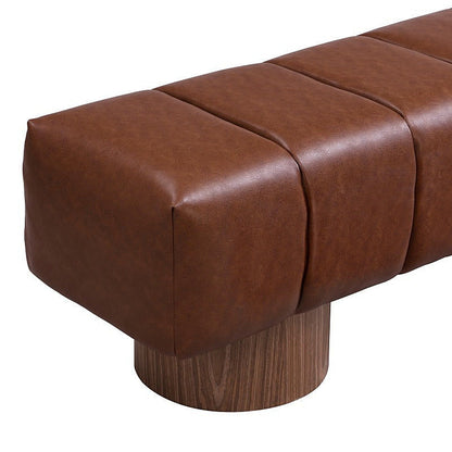 Close view of brown faux-leather upholstery and a wood-grain pedestal