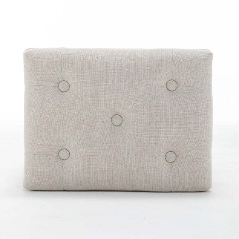 Top view of the beige stool's rectangular button-tufted cushion