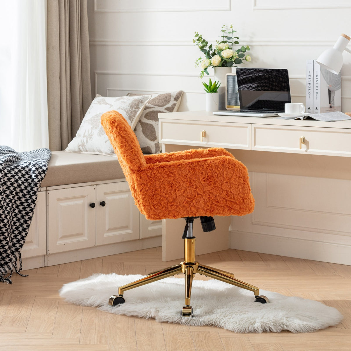 Side view of the orange upholstered desk chair