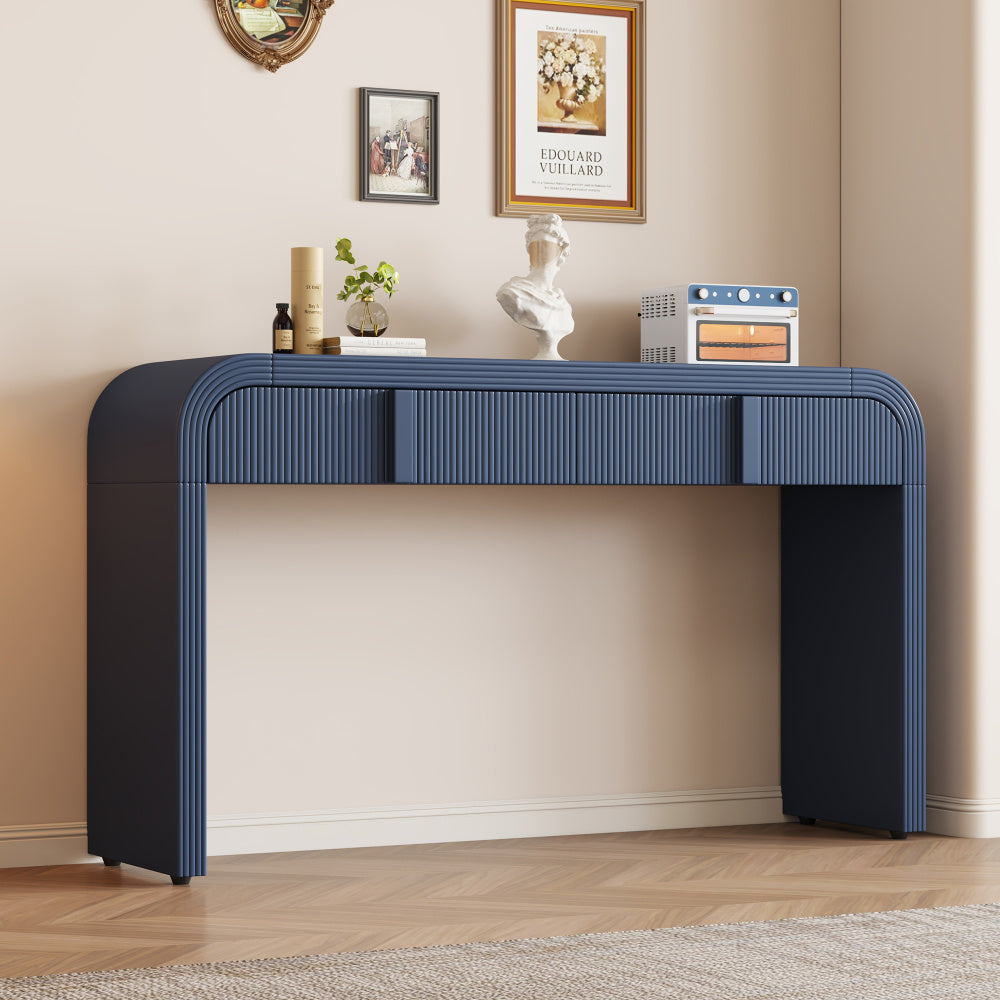 Navy Blue fluted two-drawer console styled with books and decorative objects.