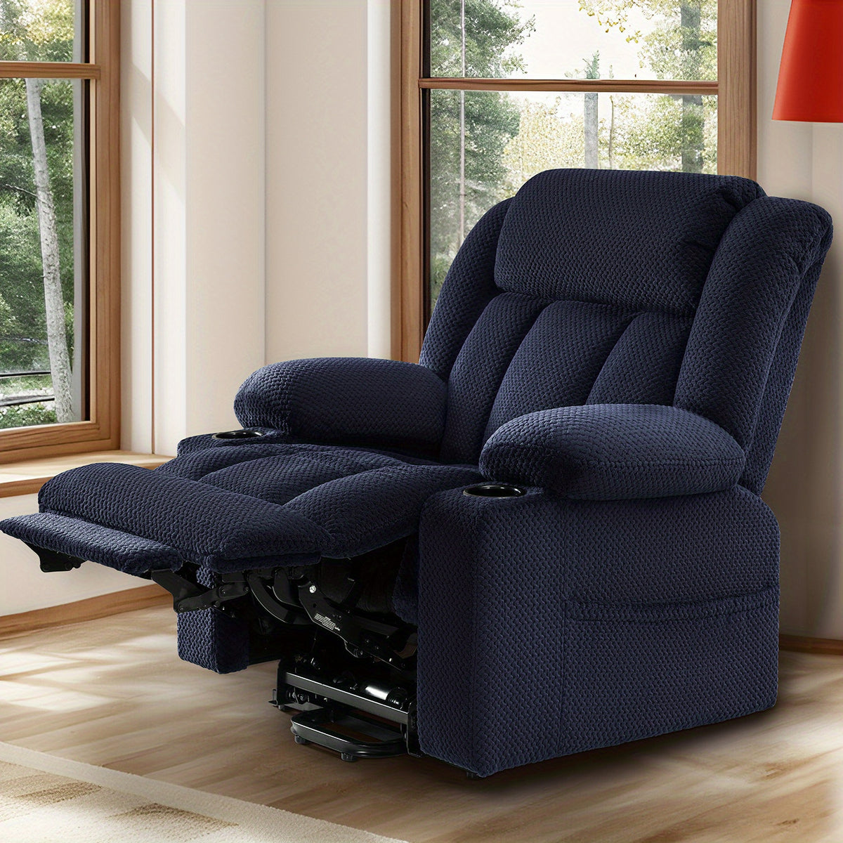 Navy blue padded recliner with its footrest extended