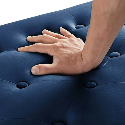 Close view of navy button-tufted padded upholstery