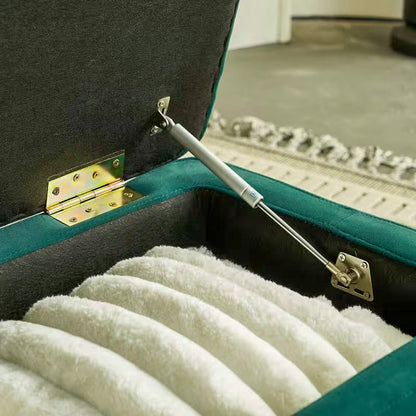 Close view of the hinge and lid-support hardware inside the green storage bench
