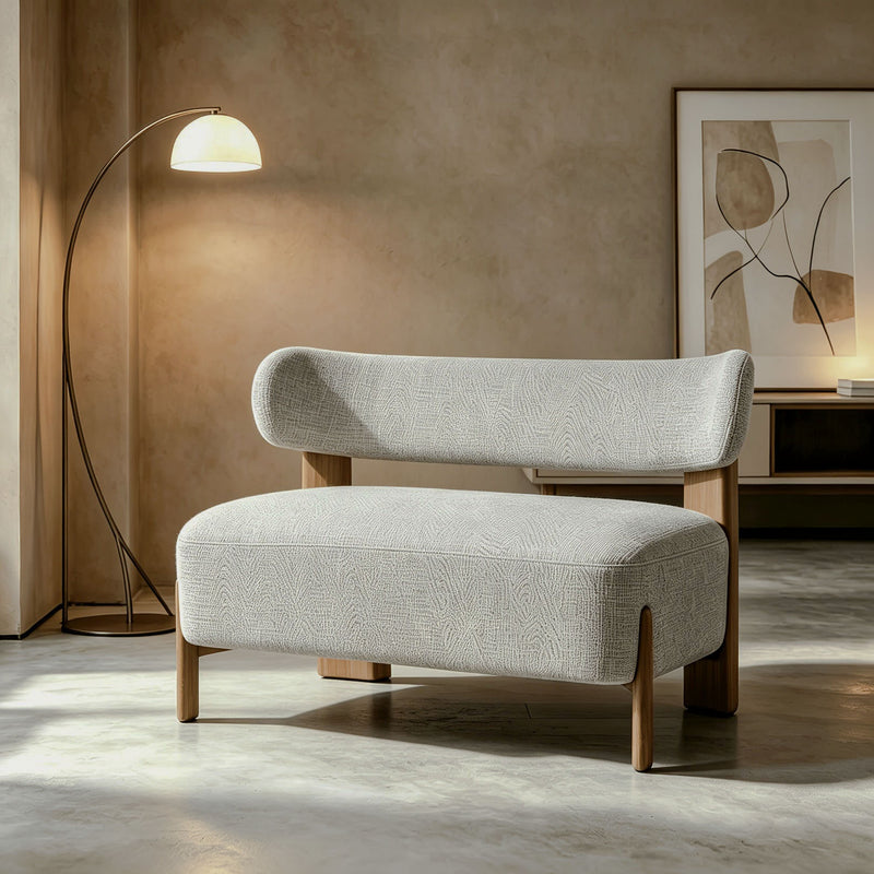 Curved-Back Loveseat with Wood Frame — loveseat in a warm minimalist room.