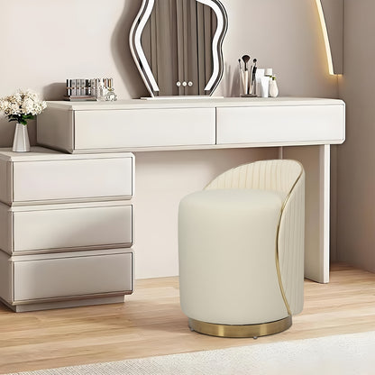 Beige leather vanity chair beside a white dressing table