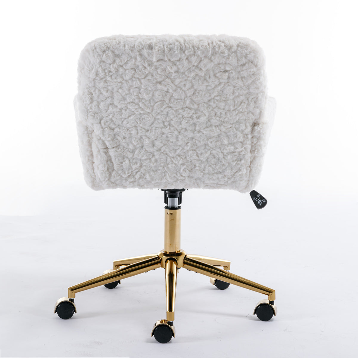 Rear view of the white chair showing upholstered back and gold-tone base