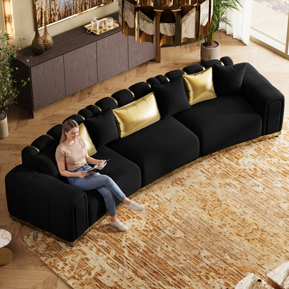 Curved Velvet Sofa with Metal Trim — overhead sofa view shown with seated person.