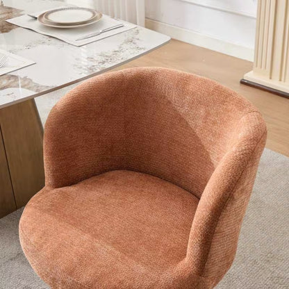 Close view of the terracotta chair's rounded seat and padded back
