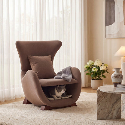 Brown sculptural upholstered accent chair with a curved wood frame and lower storage nook