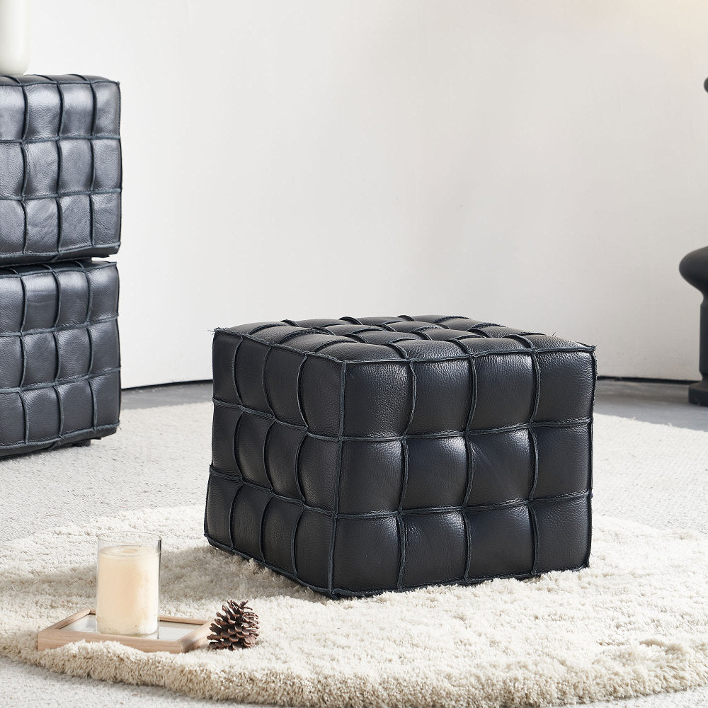 Square Tufted Ottoman — black grid-tufted cube ottoman in a room