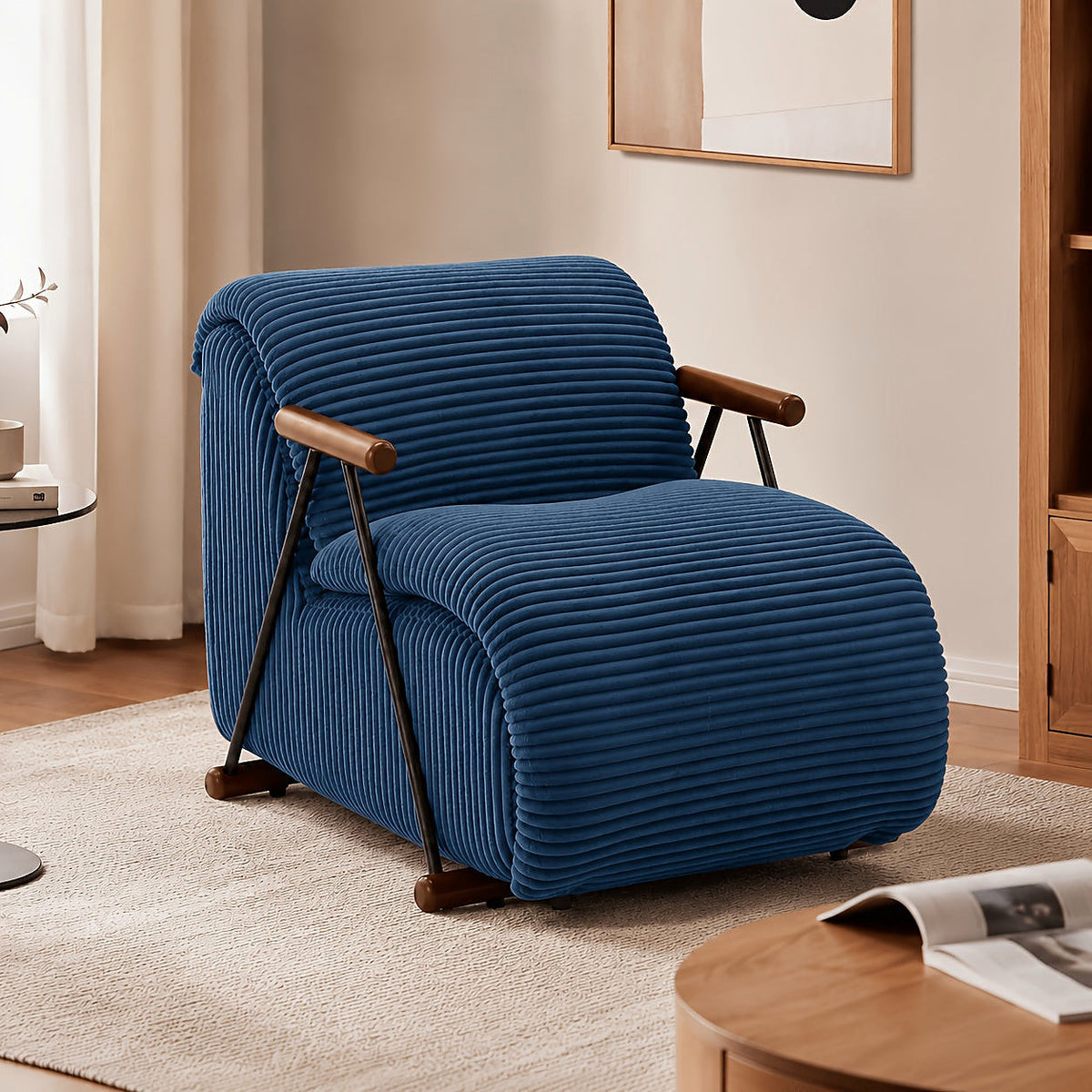 Navy wide corduroy lounge chair with wood arms and a black metal frame