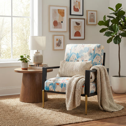 Blue and Orange Floral Velvet Accent Chair — floral chair with cushions beside a window