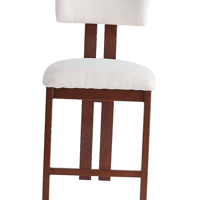 White upholstered counter stool with a brown frame and integrated footrest