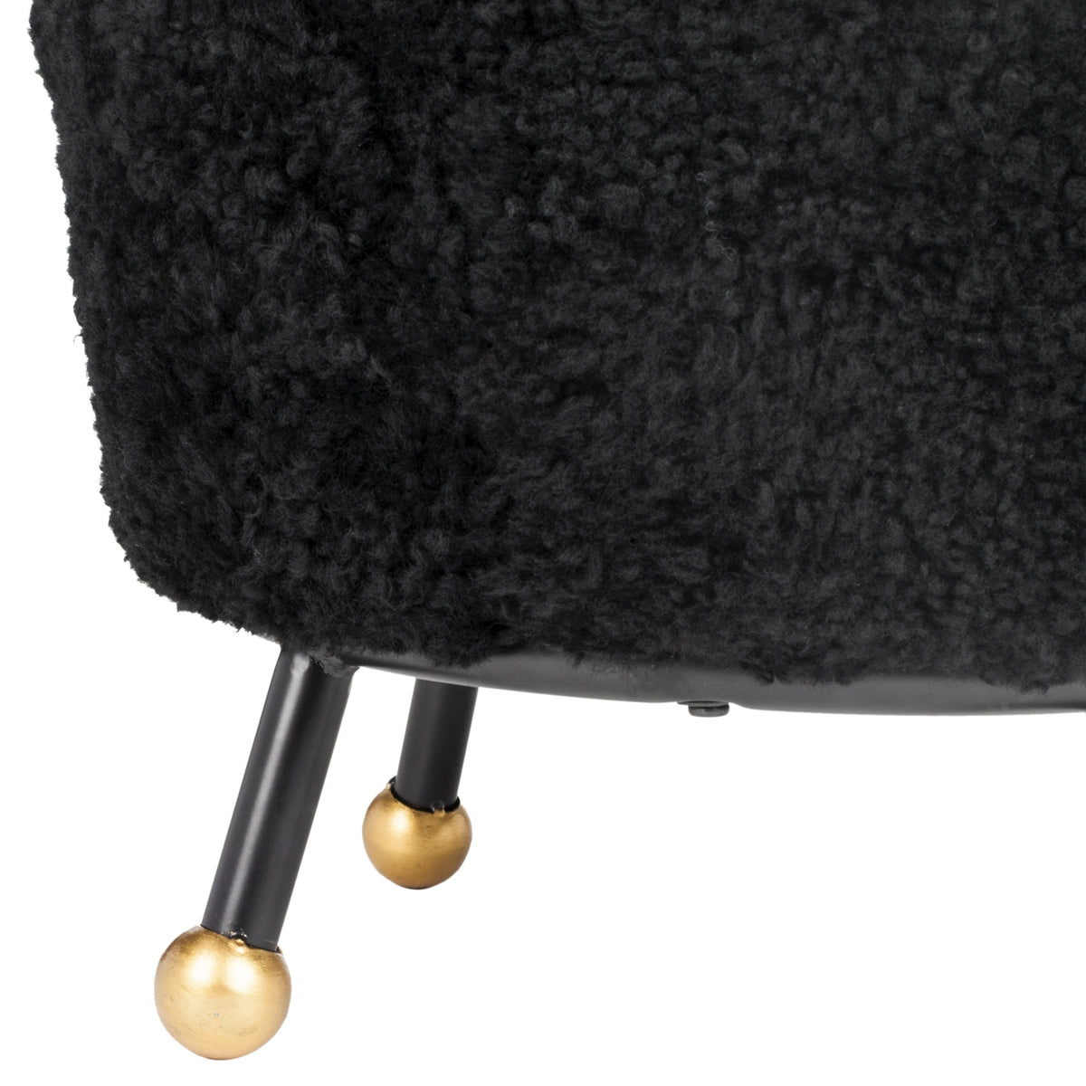 Oriana Black Shag Ottoman — close-up of black shag texture and a gold-tipped leg