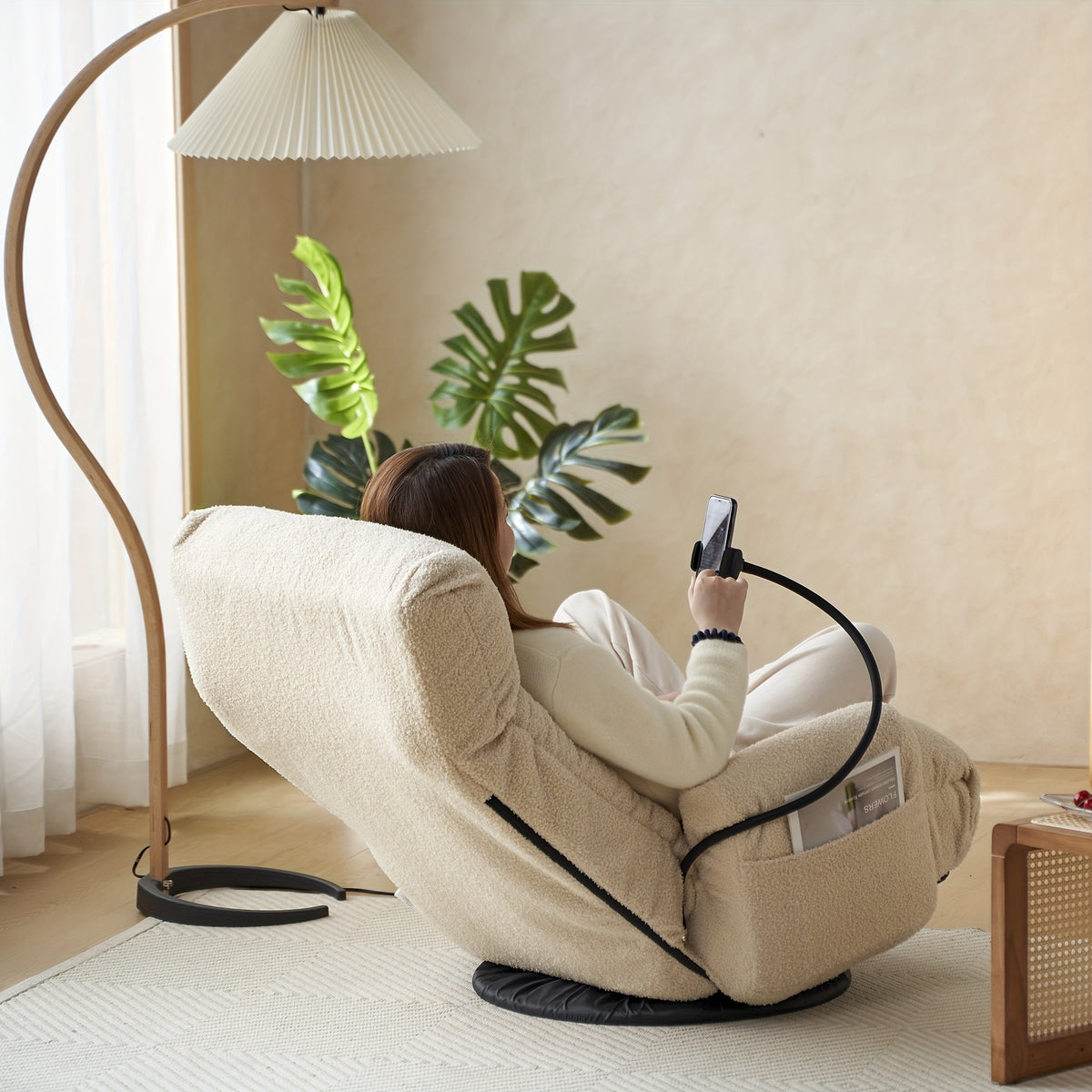 Five-Position Swivel Floor Chair with Phone Holder — rear view with a seated person and side pocket