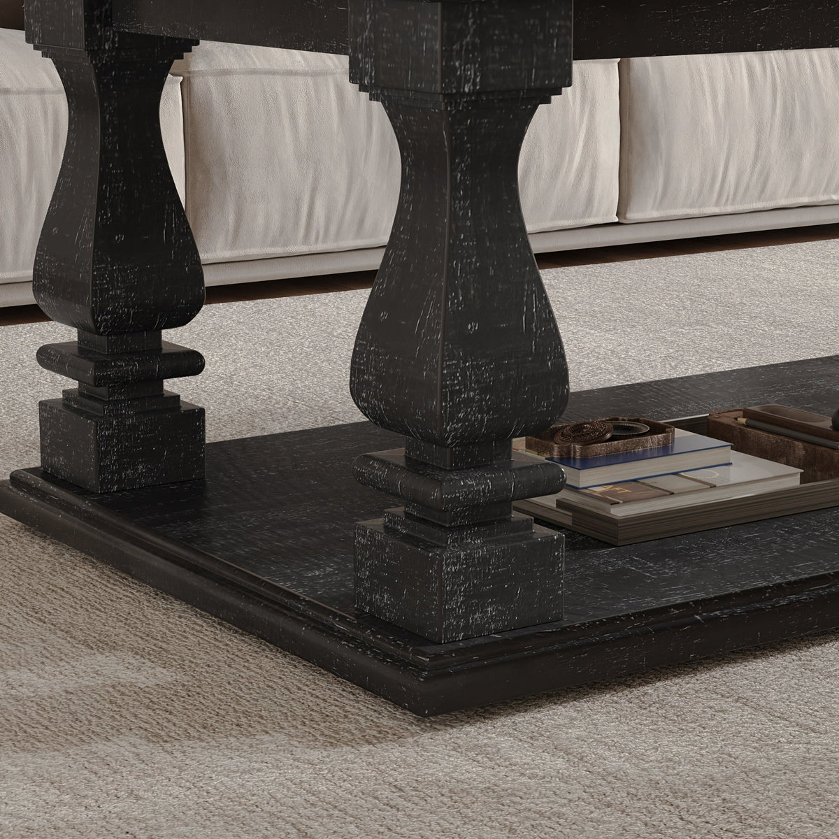 Detail of a black baluster leg and the coffee table's lower shelf