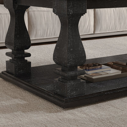 Detail of a black baluster leg and the coffee table's lower shelf