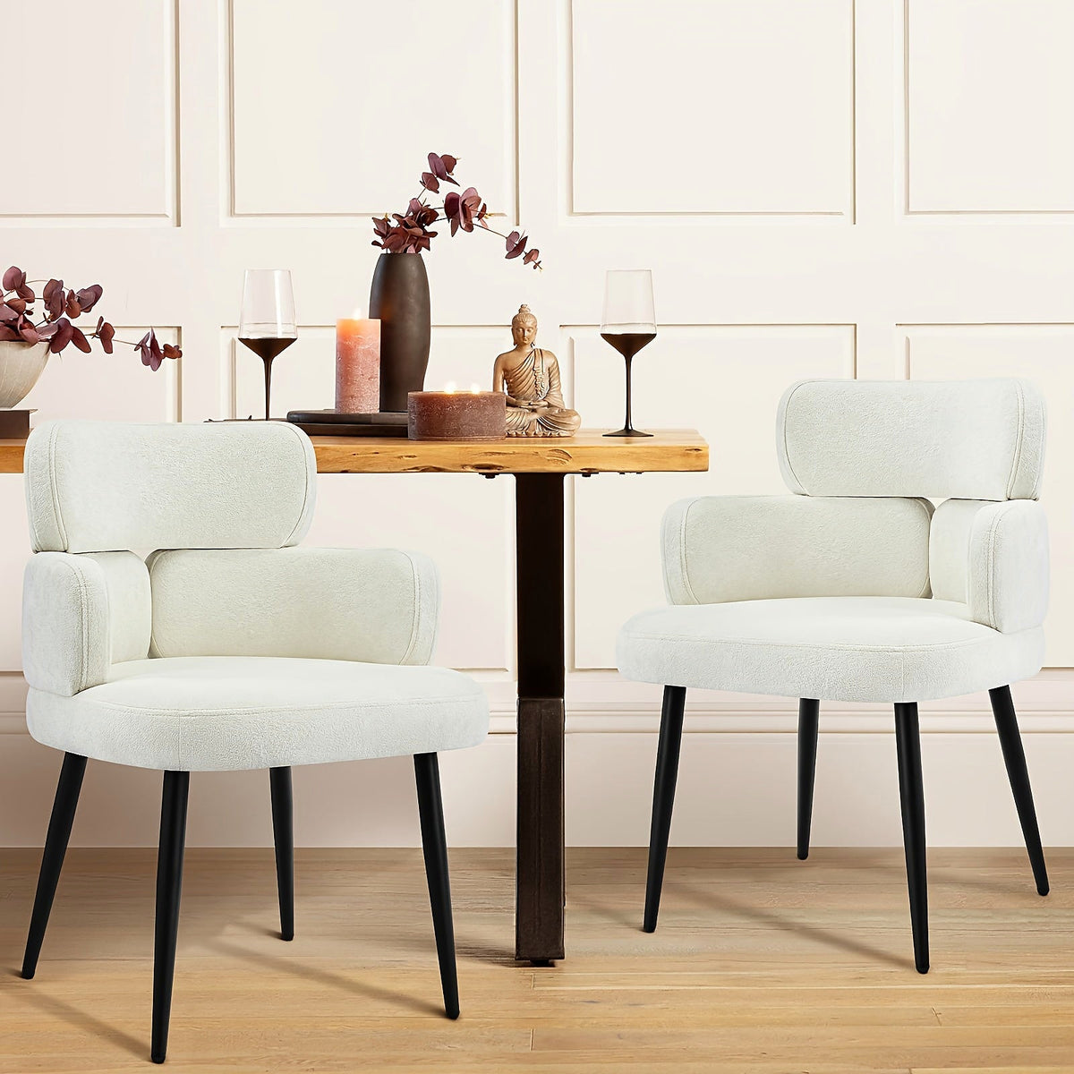White chenille accent chair with a segmented padded back and black metal legs