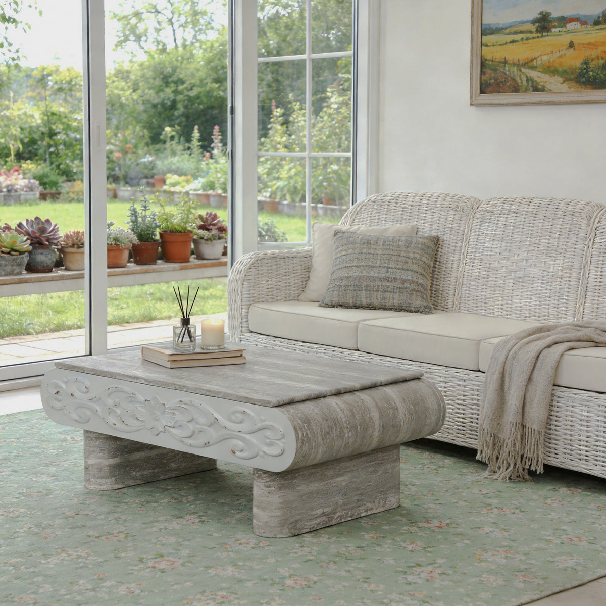 Gray wood-grain coffee table with floral front detail beside a sofa