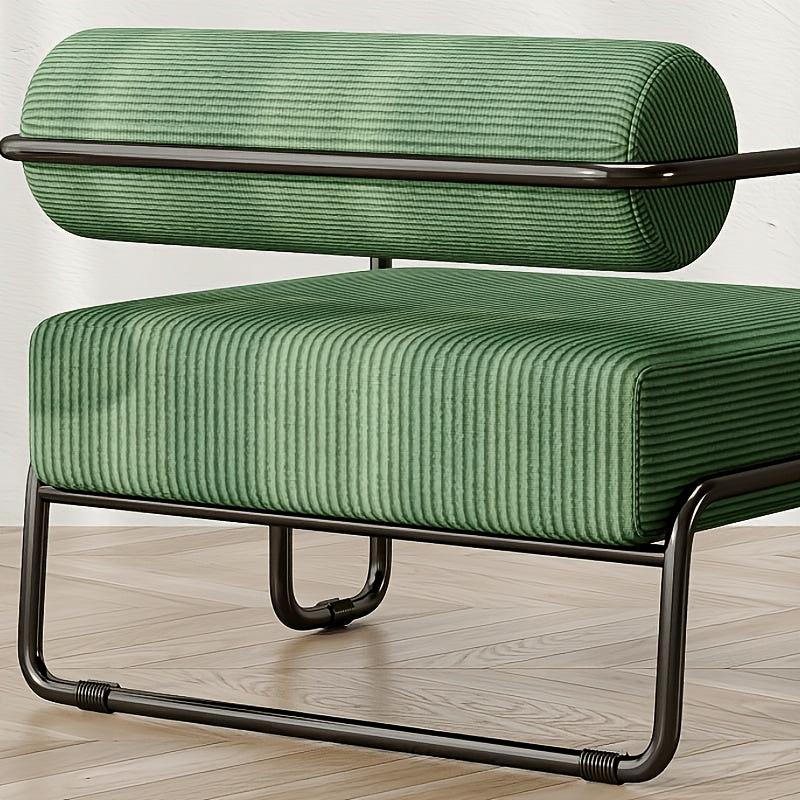 Green Ribbed Lounge Chair with Metal Frame — green ribbed upholstery and metal frame close-up