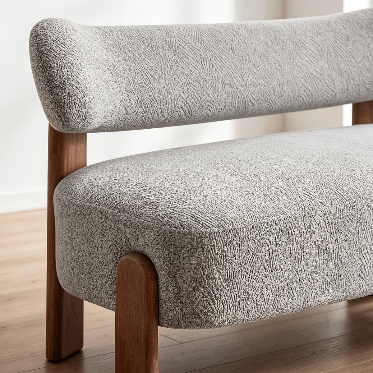 Curved-Back Loveseat with Wood Frame — curved back, upholstery and wood frame close-up.