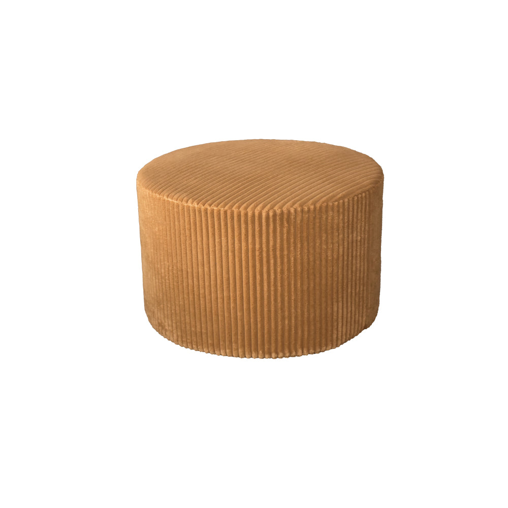 Round tan corduroy ottoman on white background