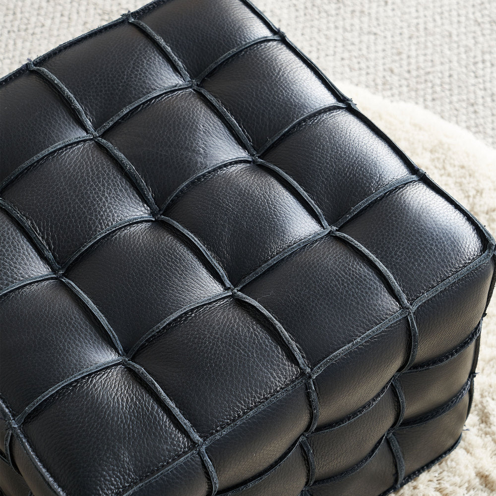 Square Tufted Ottoman — black tufting and upholstery texture close-up