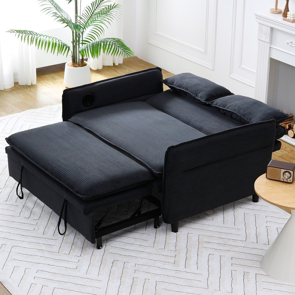 Ribbed Convertible Sleeper Sofa with Cup Holders — flat bed configuration with lowered arms.