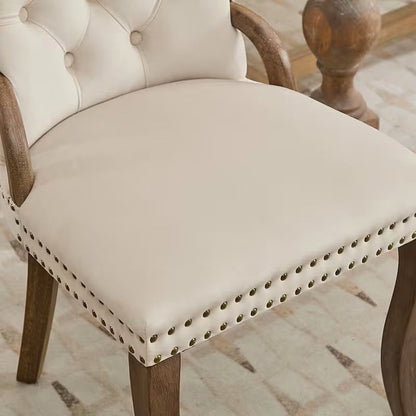 Beige velvet dining chair with a tufted back, wood handle, and curved wood legs