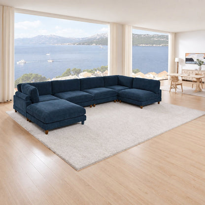 Navy corduroy Haven sectional with chaise seating in a waterfront living room