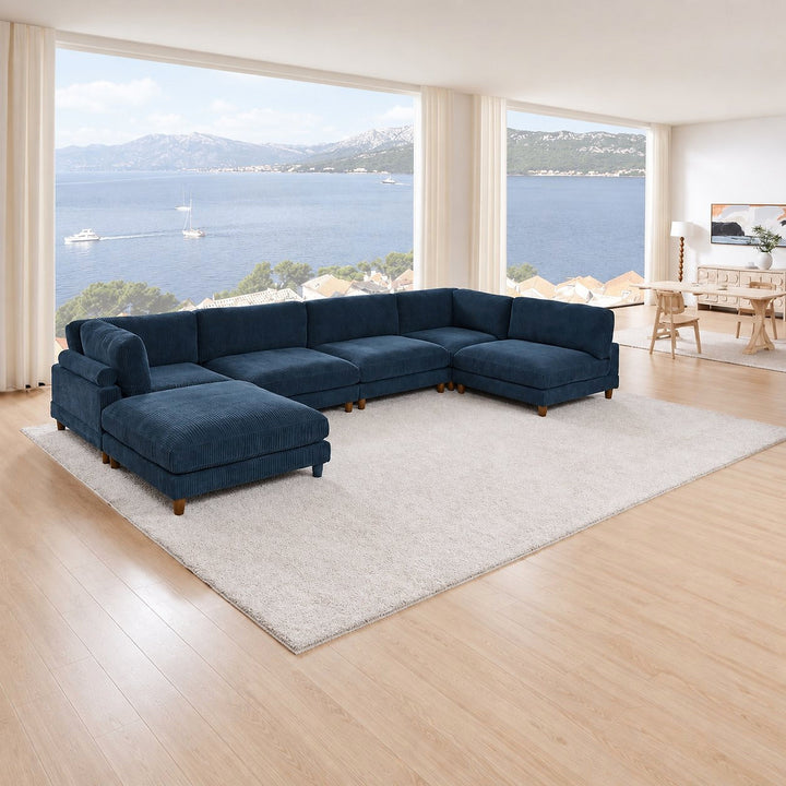 Navy corduroy Haven sectional with chaise seating in a waterfront living room