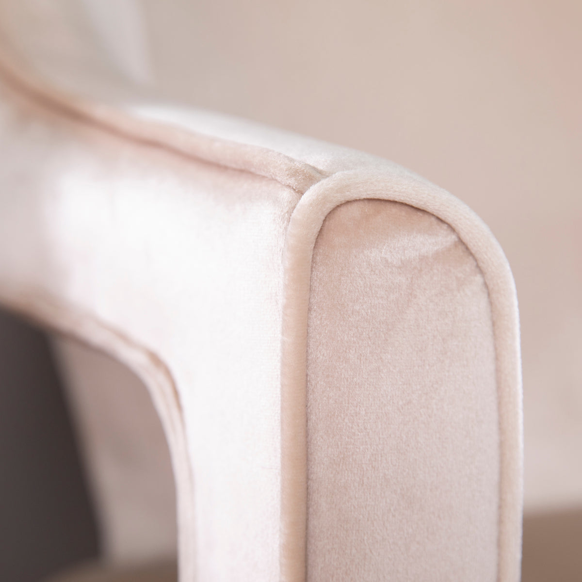 Eldermain Blush Velvet Accent Chair — upholstered arm and piping close-up